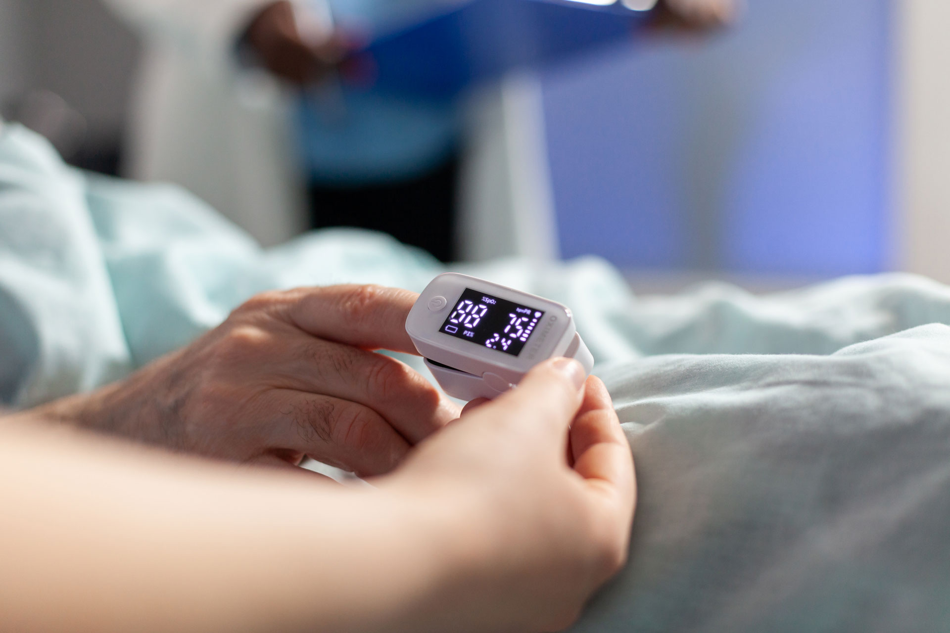 close-up-oxymeter-attached-sick-senior-patient